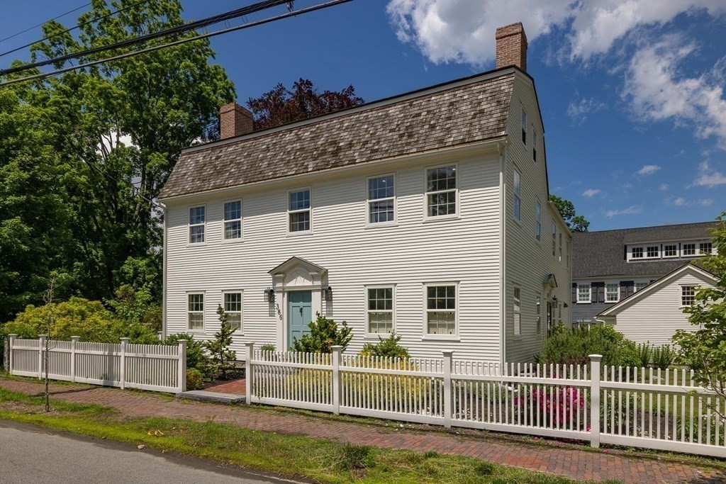 a view of a house with a yard and plants