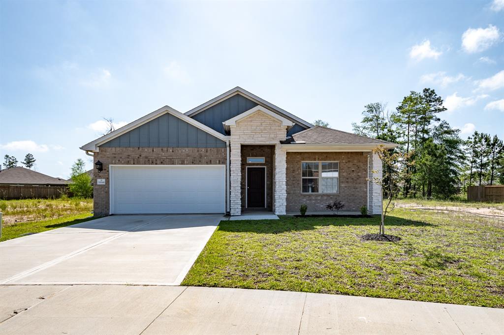 a house with yard in front of it