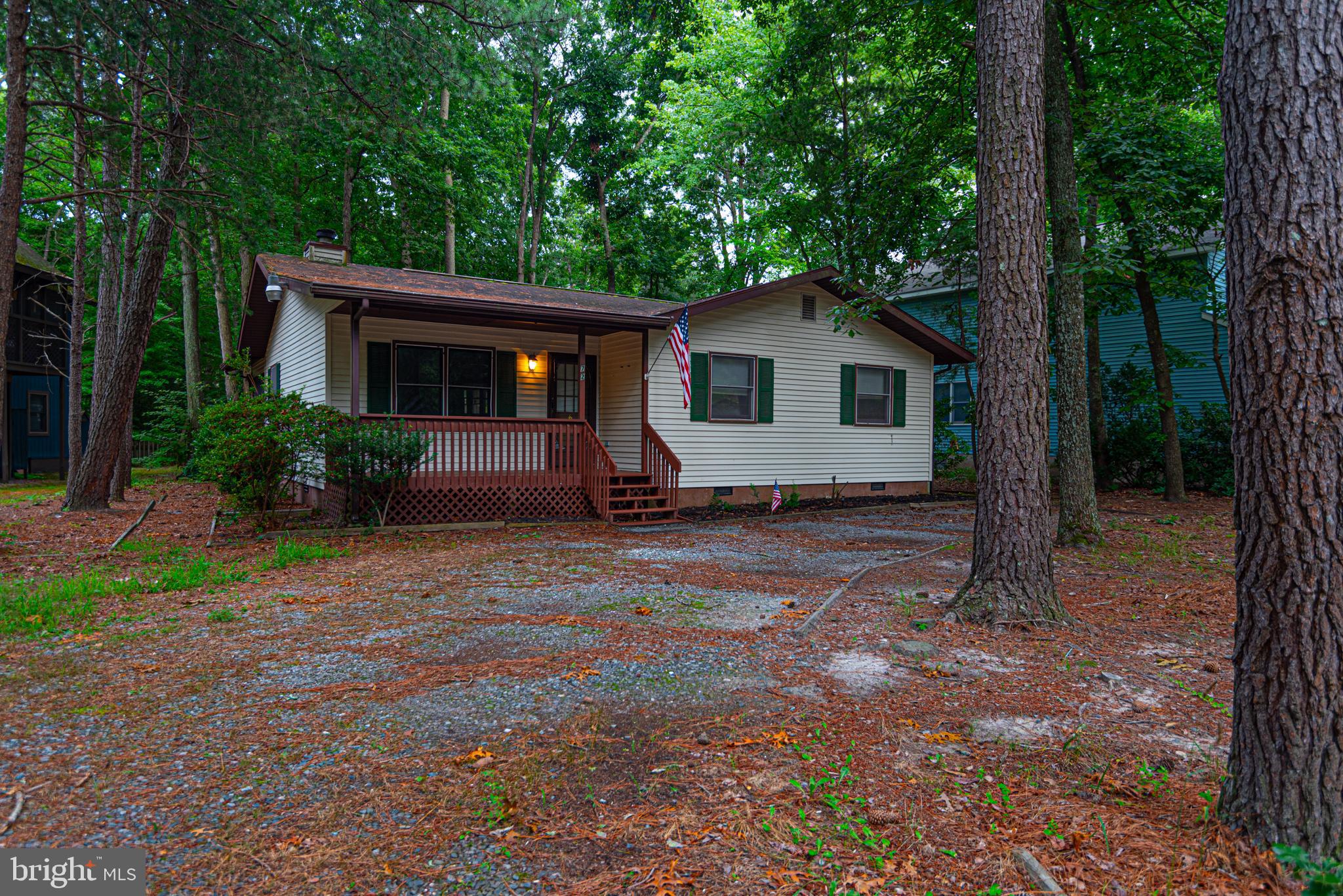 a house with trees in the background