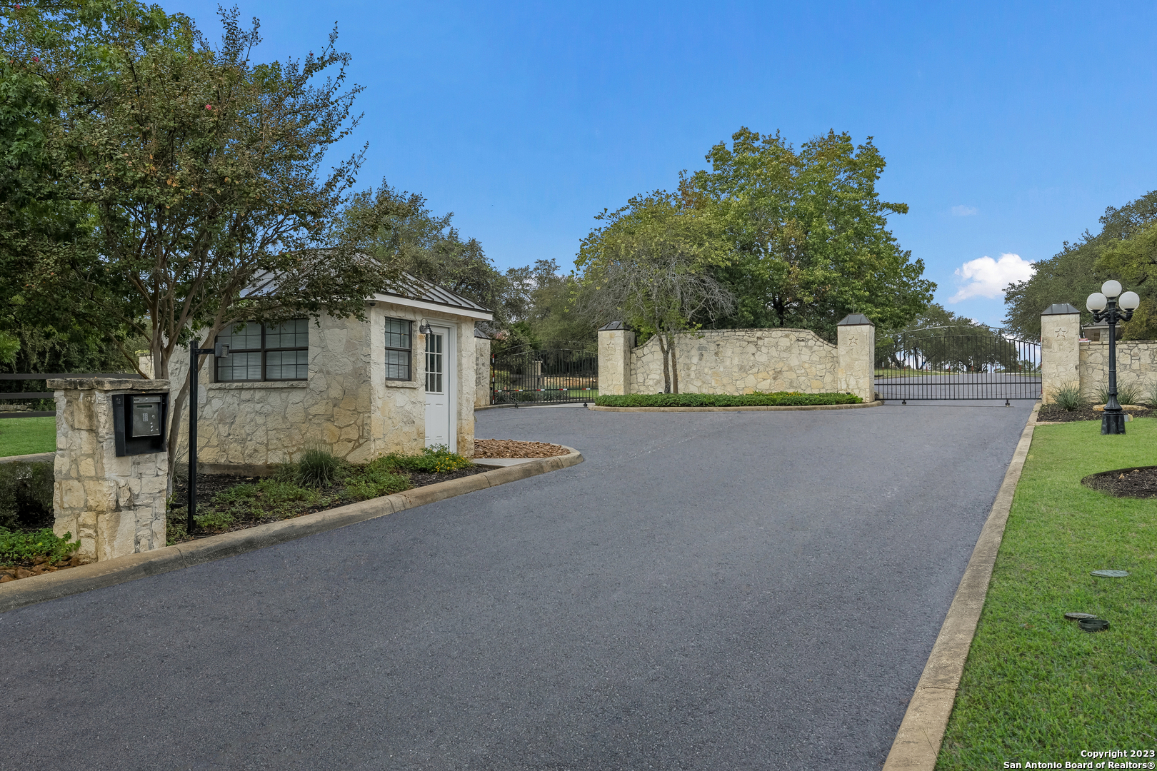 a view of a house with a yard and garage