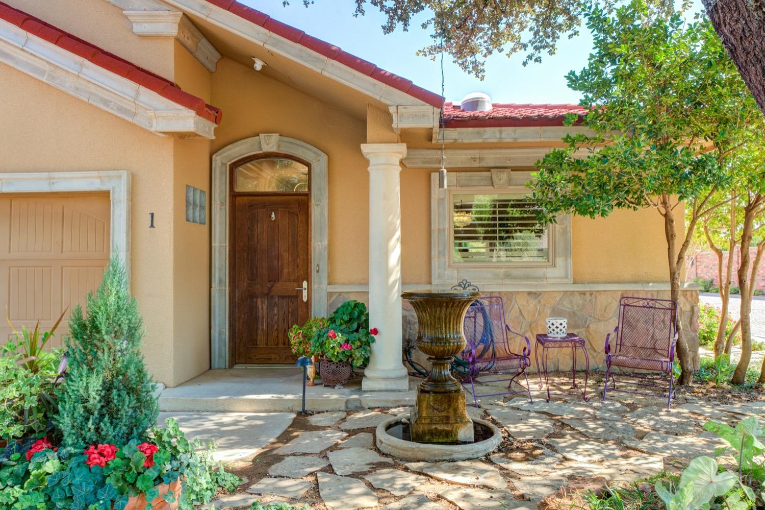 a front view of house with outdoor seating