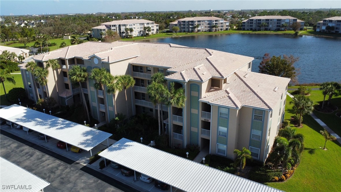 an aerial view of a house with a lake view