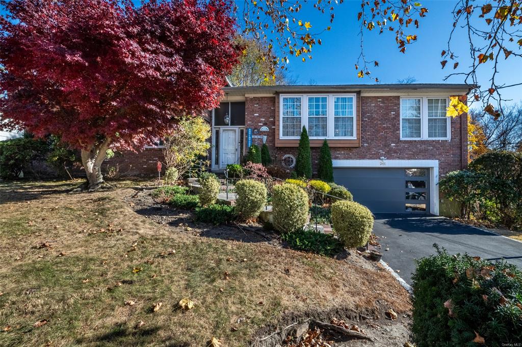 View of front of property with a garage