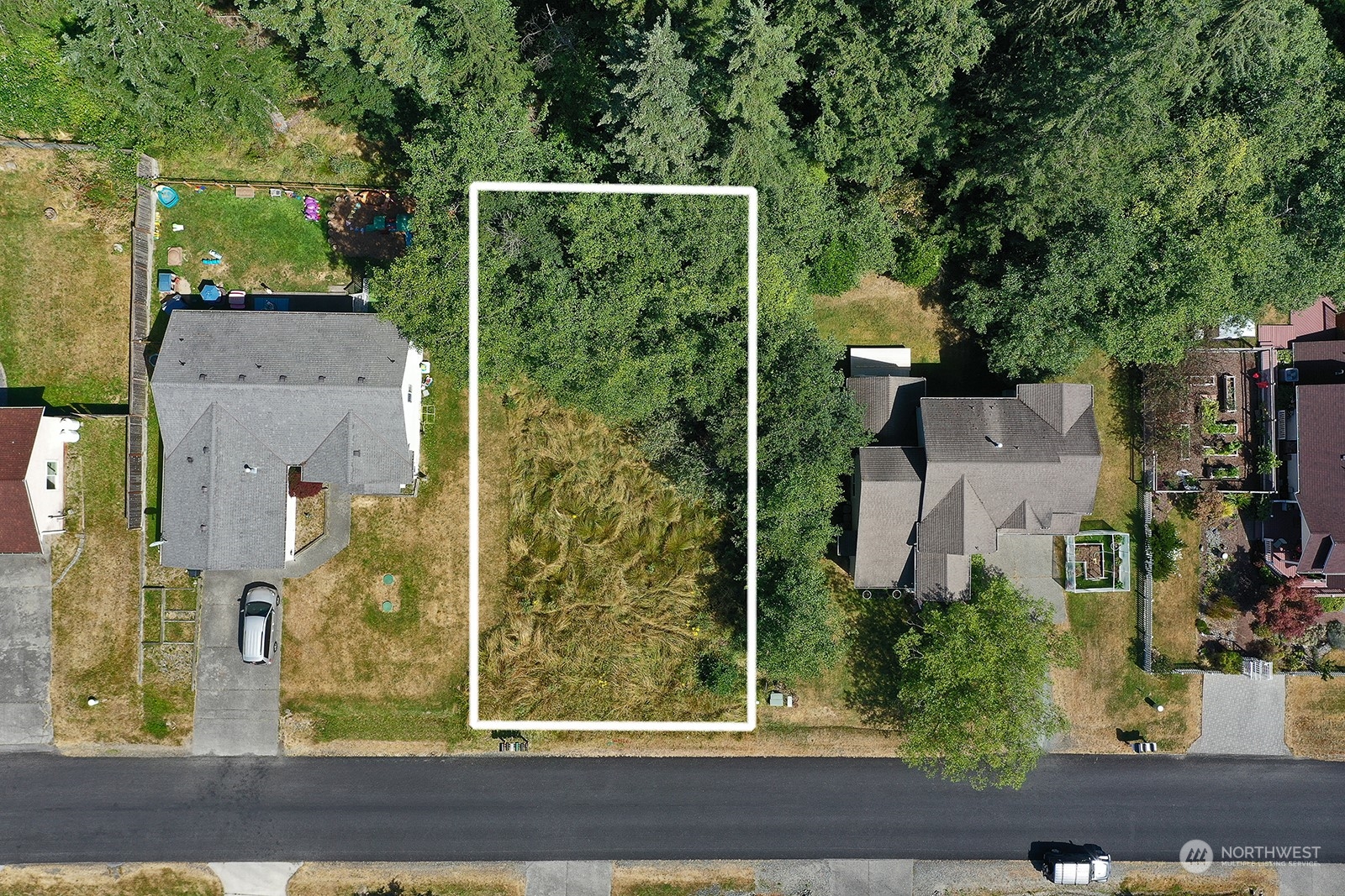 aerial view of a house with a yard