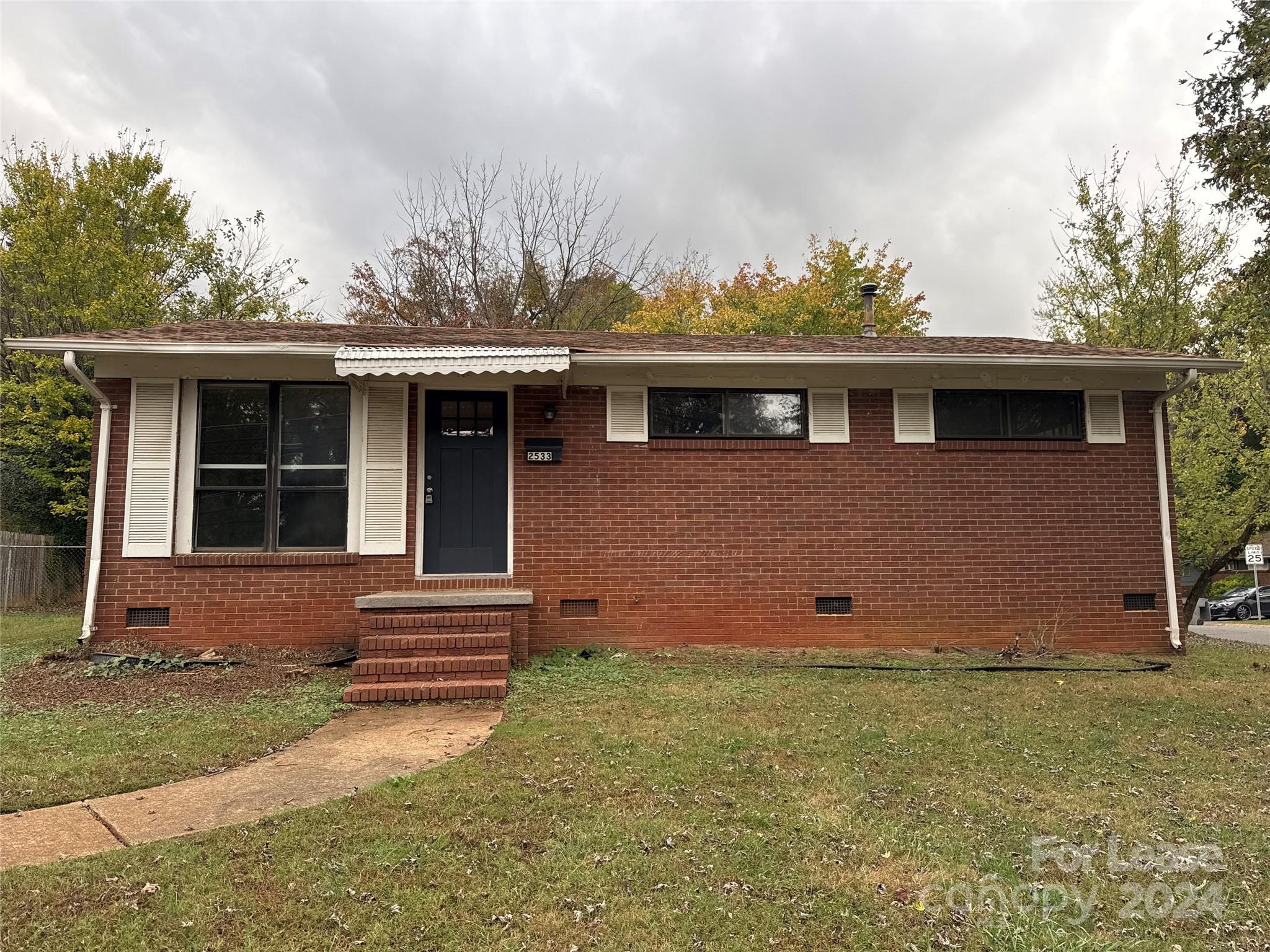 front view of a house with a yard