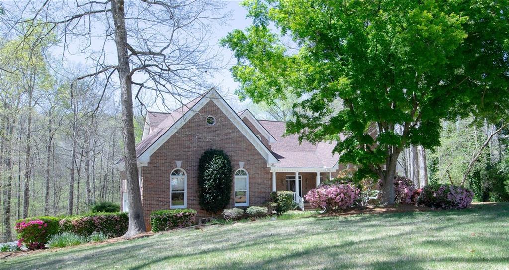 a front view of a house with garden