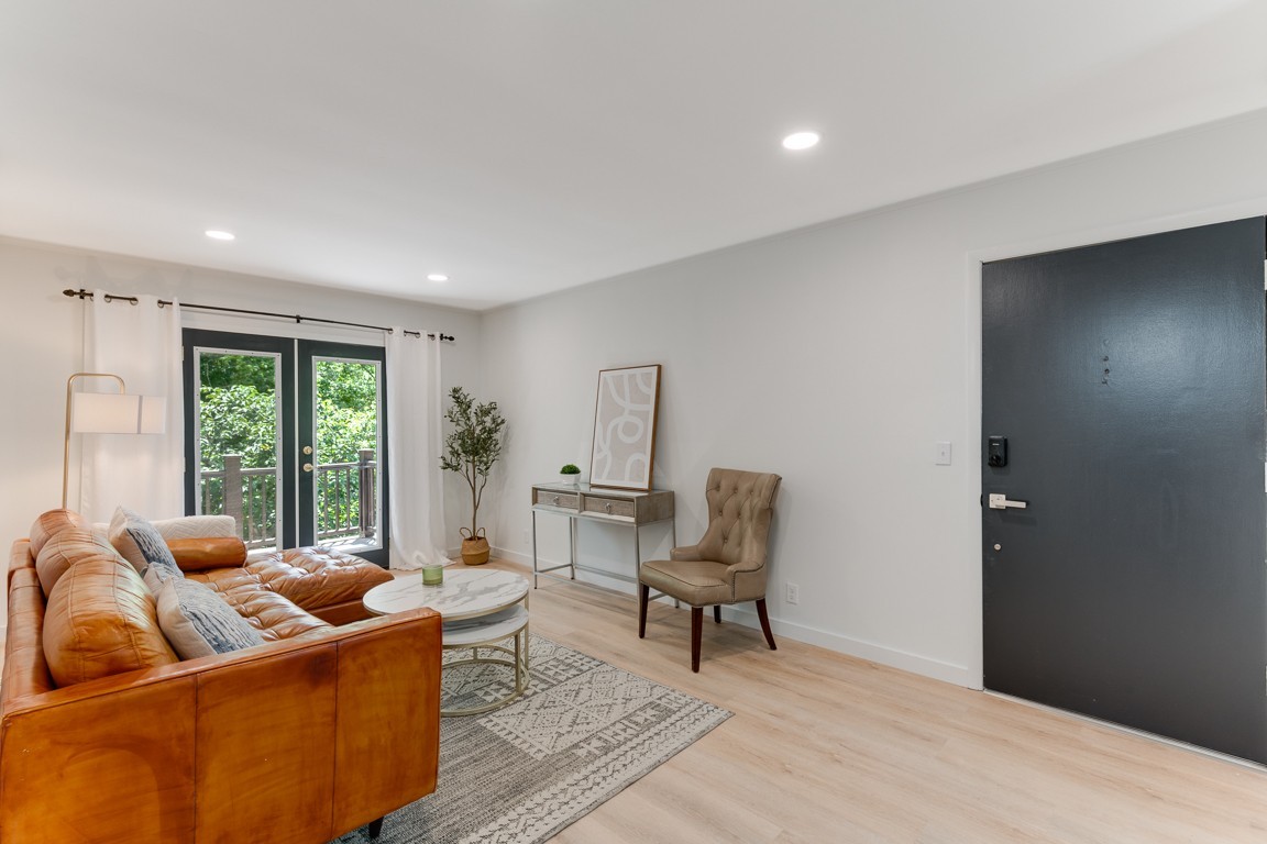 a living room with furniture and a window