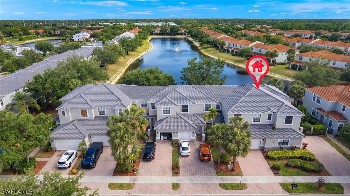 an aerial view of residential houses and outdoor space