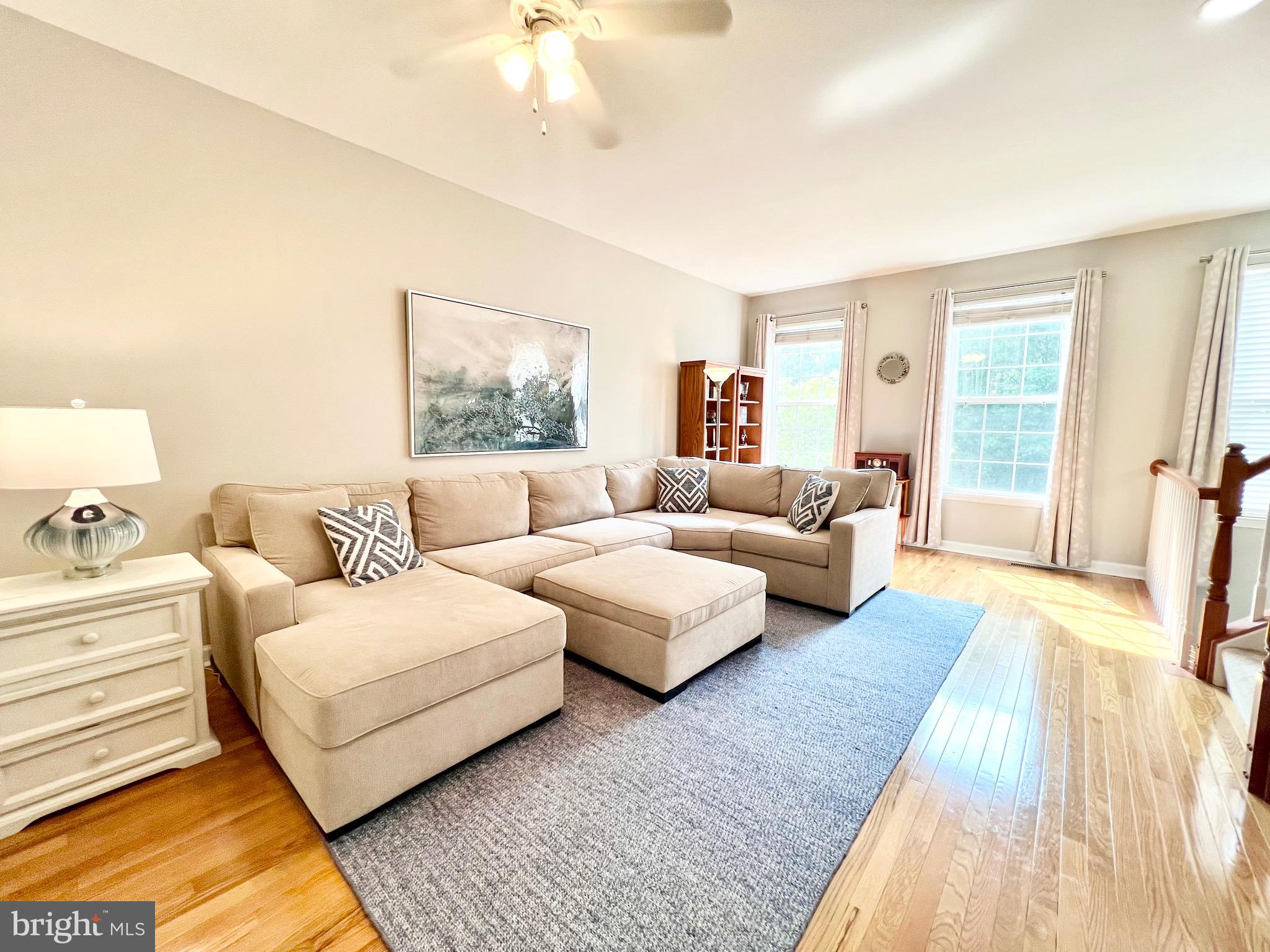 a spacious bedroom with a large bed and a couch