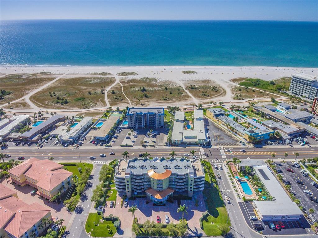 an aerial view of a house with a ocean view