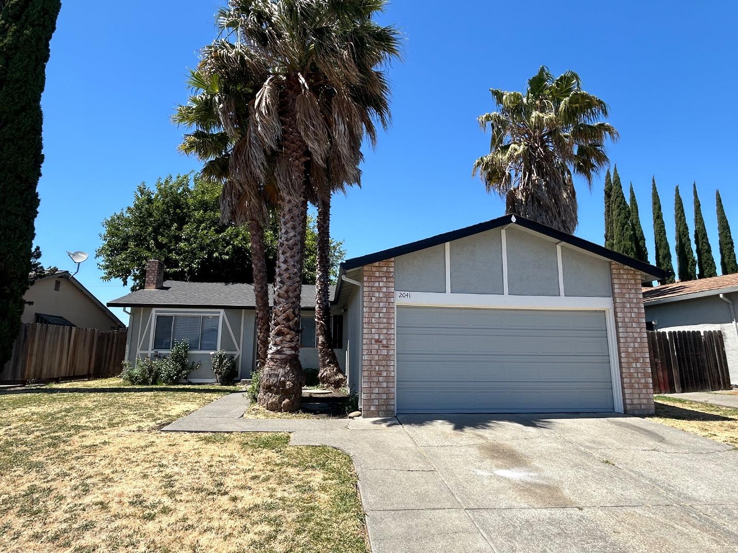 a house with a yard and garage