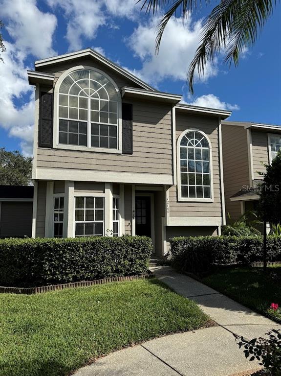 a front view of a house with a yard