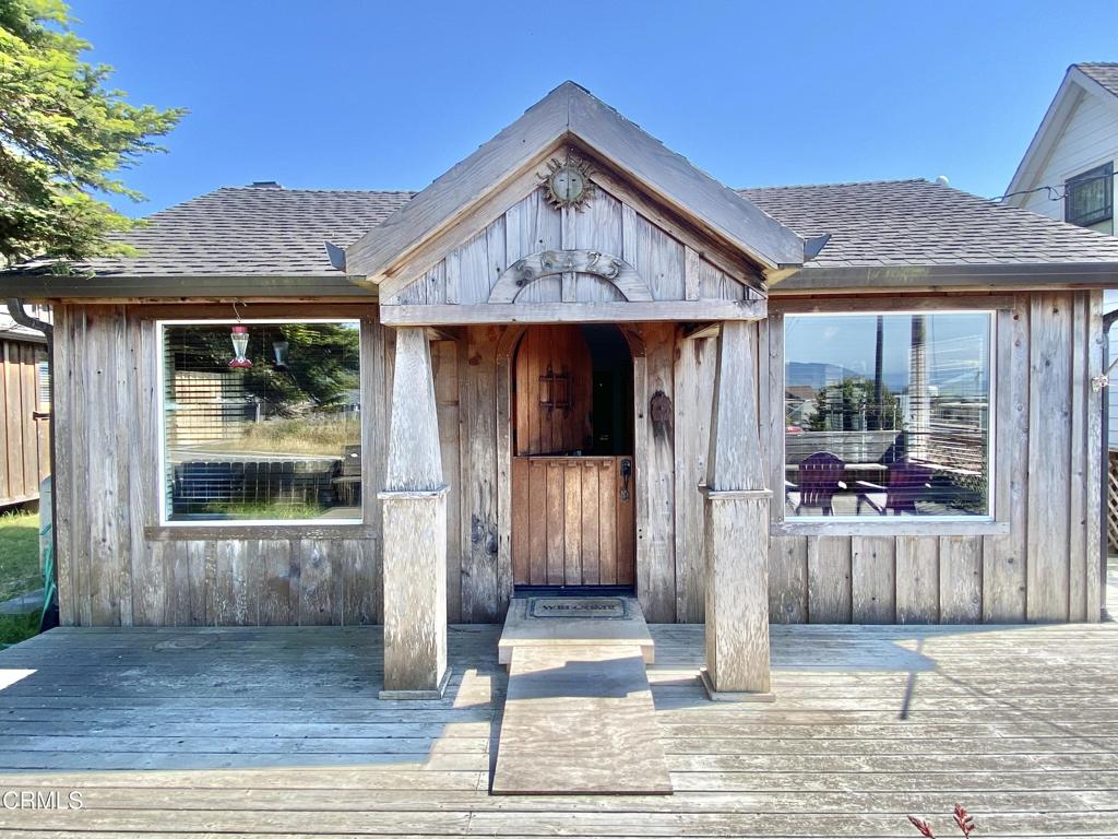 a front view of a house with a porch