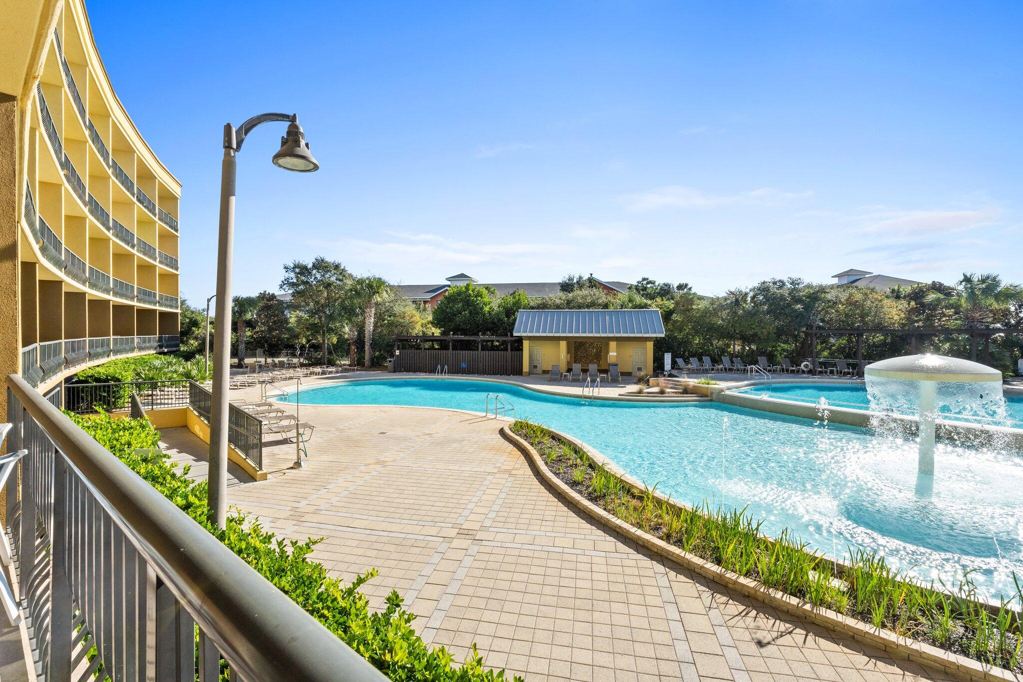 a view of a balcony with a swimming pool