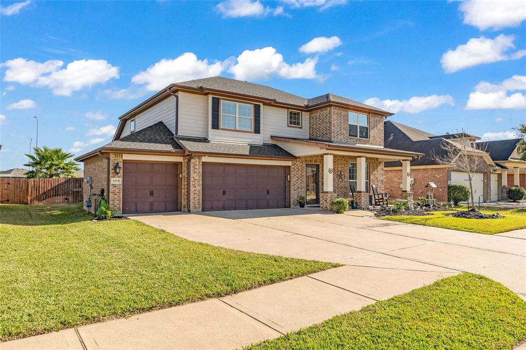 Front of home, 3 car garage with over-sized driveway.