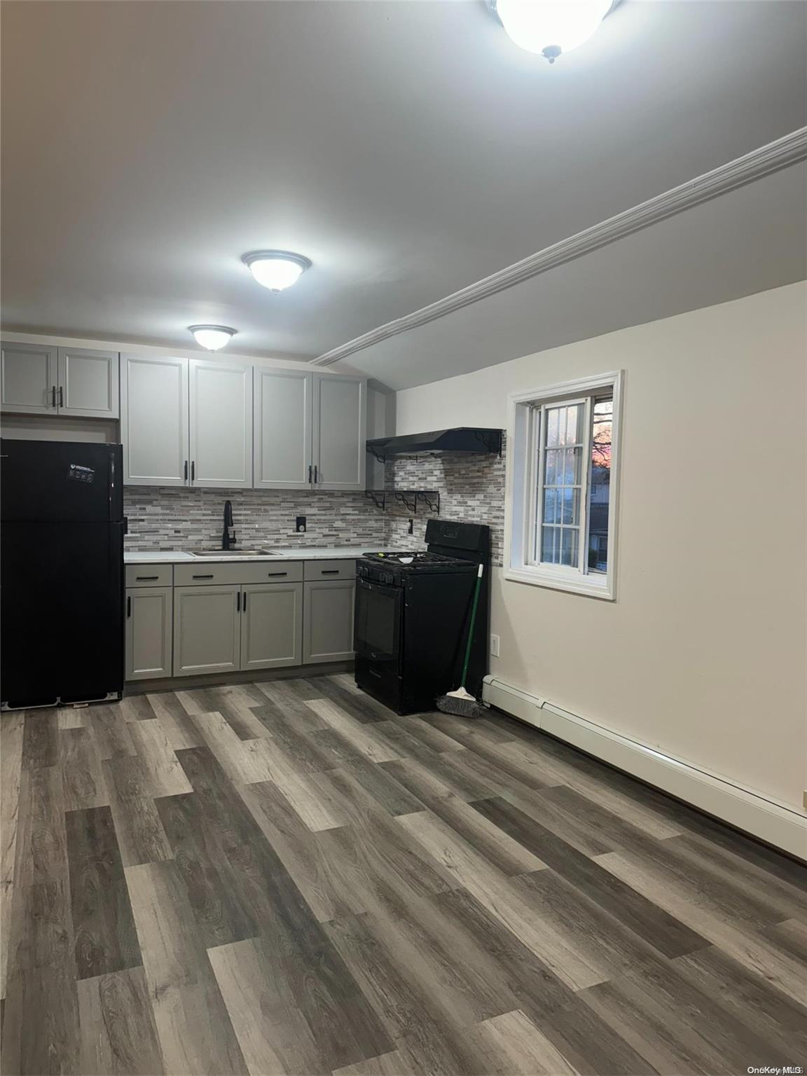 a kitchen with stainless steel appliances granite countertop a refrigerator sink and cabinets