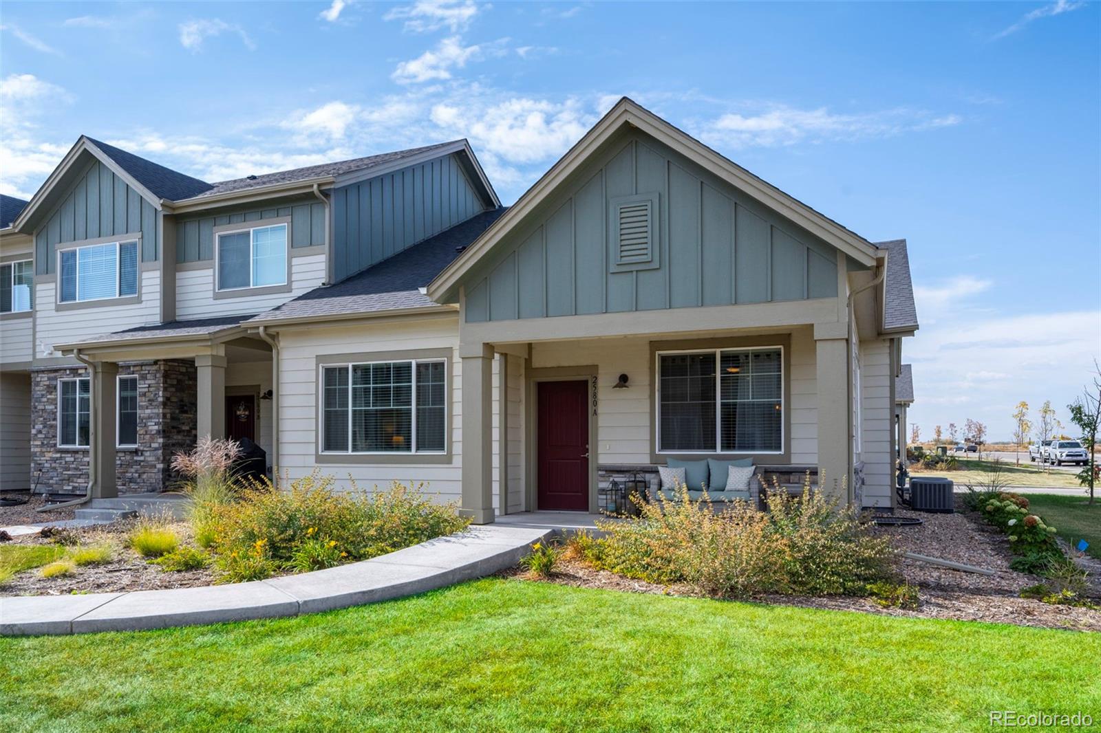 a front view of a house with a yard