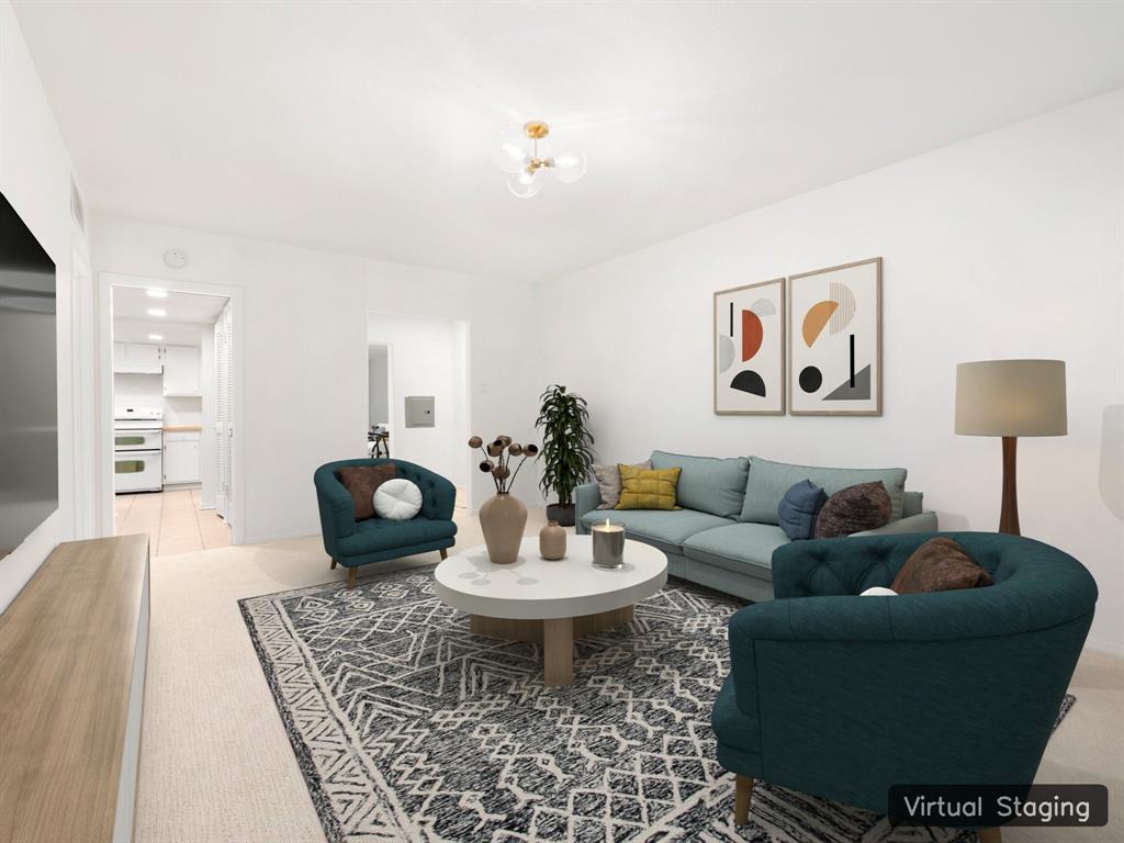 a living room with furniture and a table