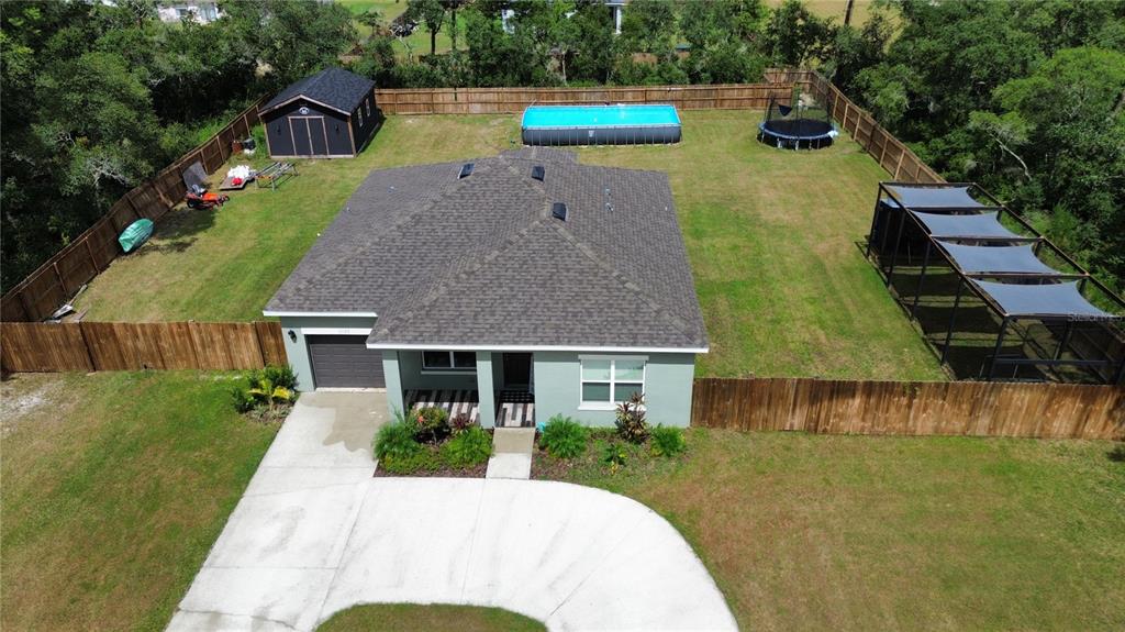 a house with swimming pool in front of it