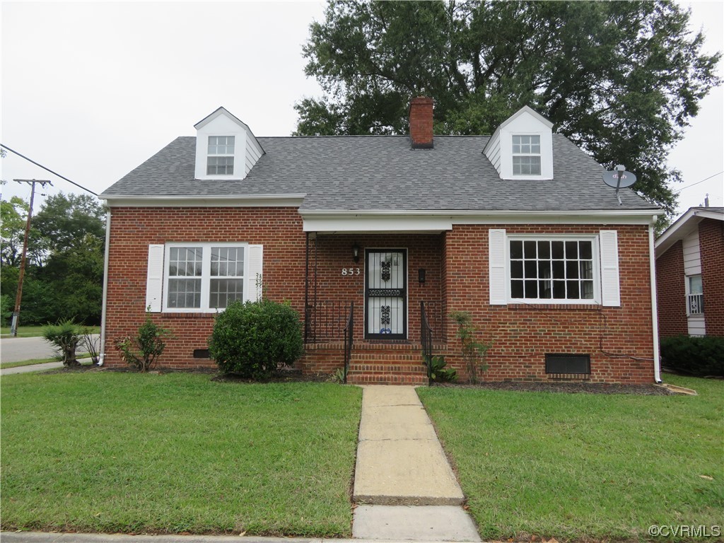 front view of a house with a yard