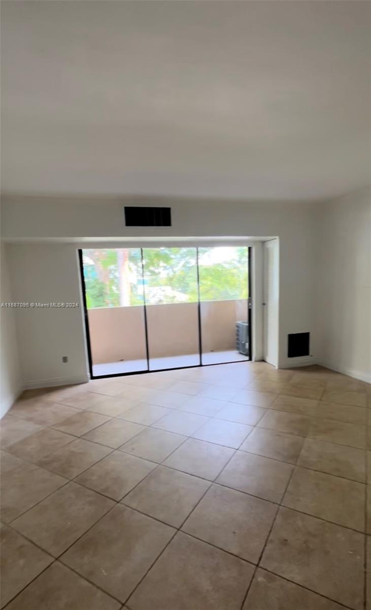 a view of an empty room with a fireplace