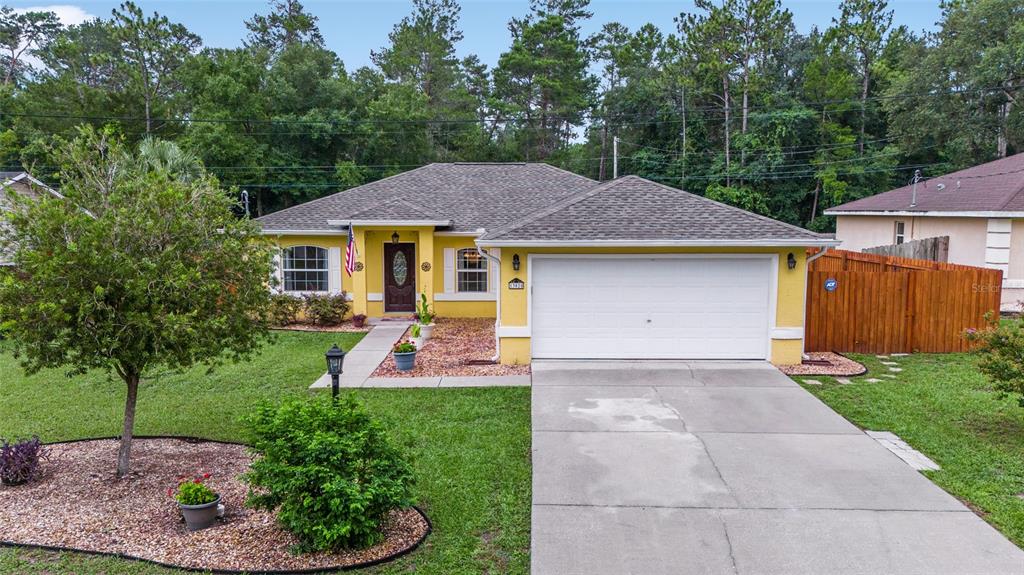 a aerial view of a house with a yard