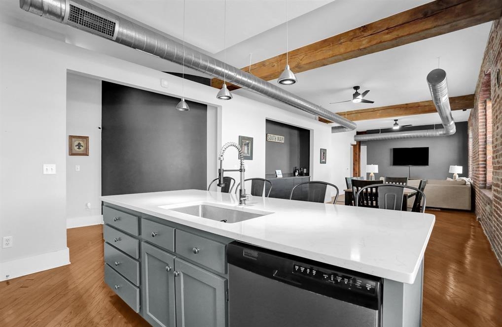 a large white kitchen with a large island