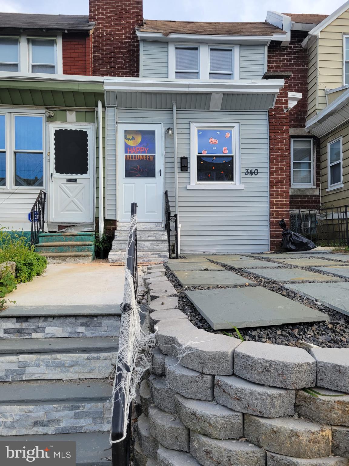 a front view of a house with garage