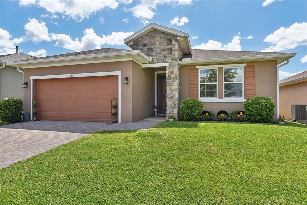 front view of a house with a yard