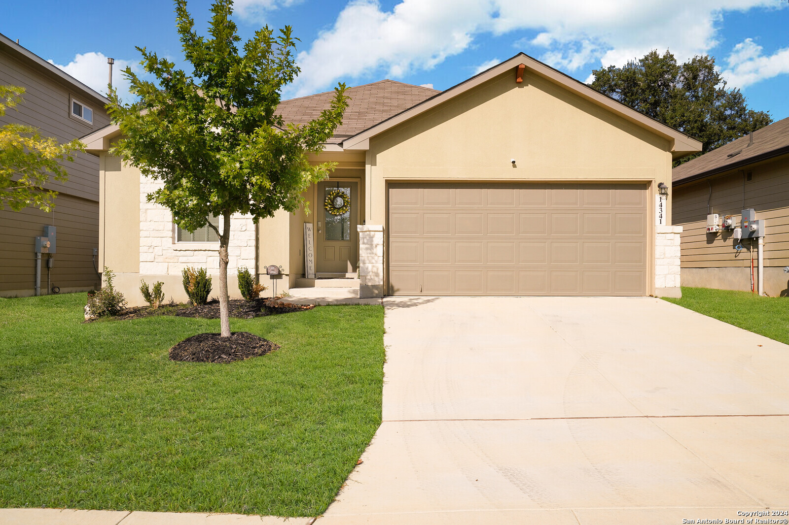 a front view of a house with garden