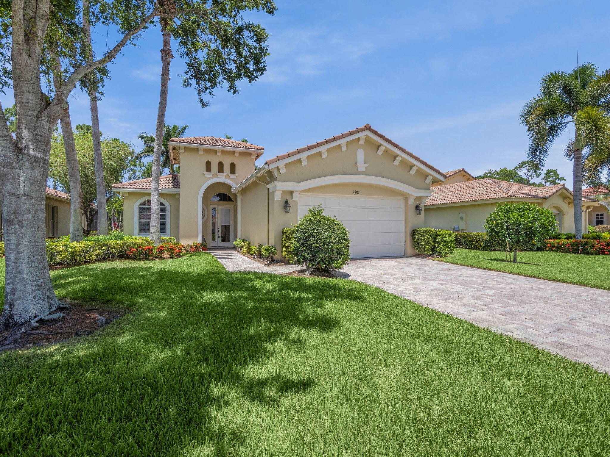 a front view of a house with garden