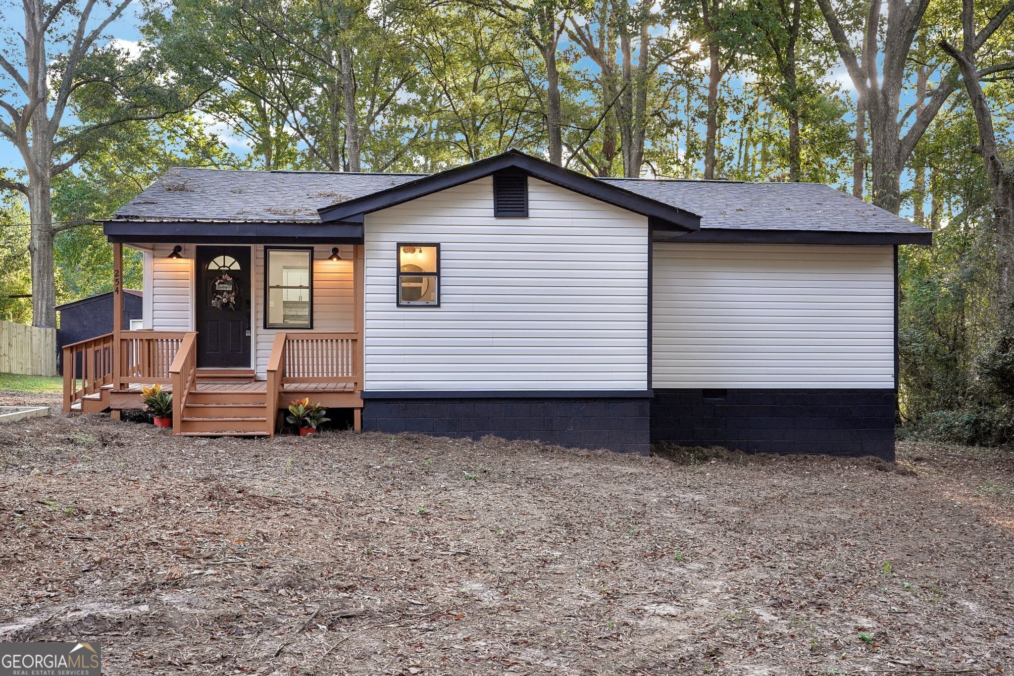 a view of a house with a yard and garage