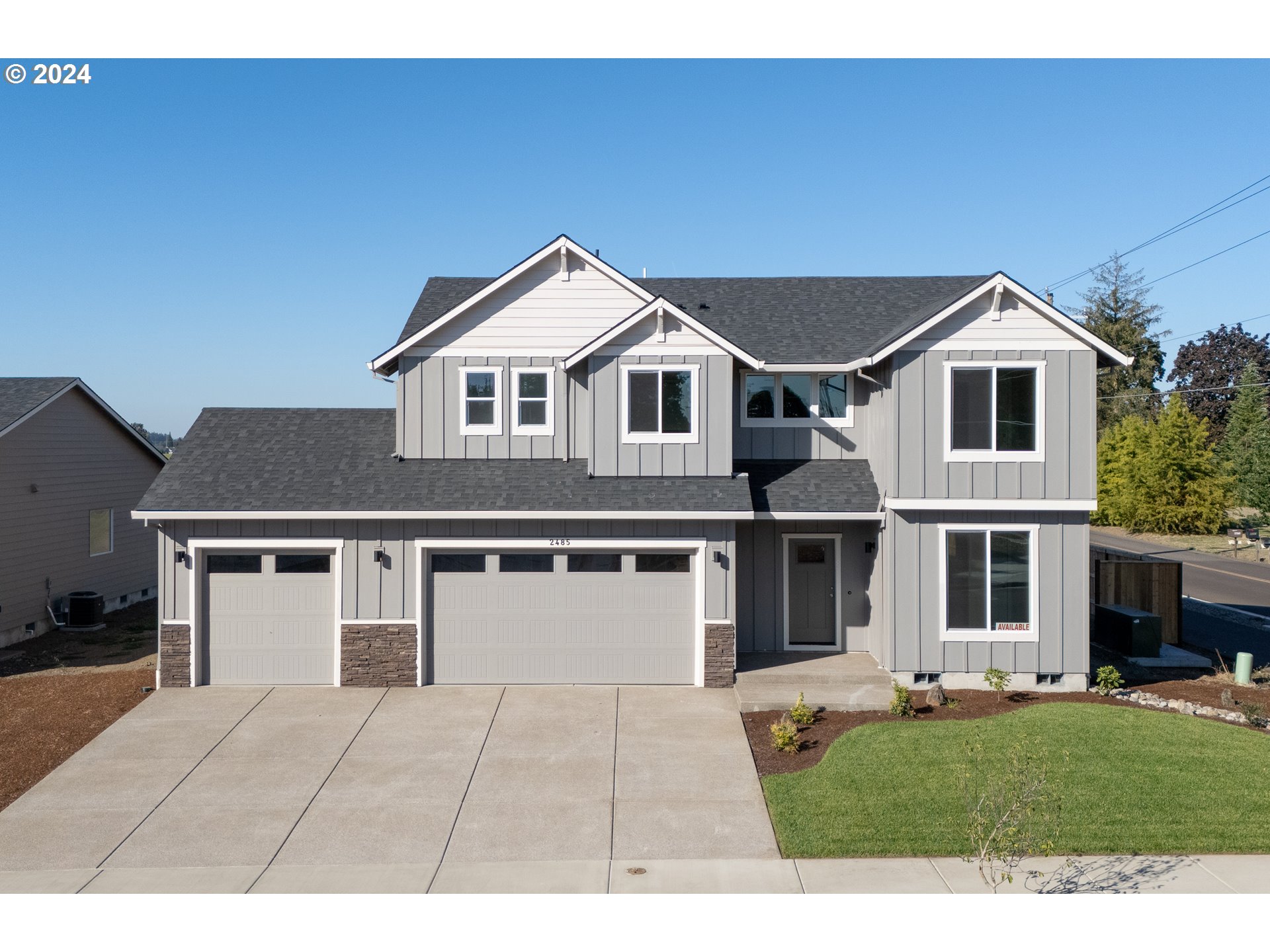 a front view of a house with a yard