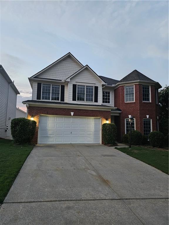 a front view of a house with yard