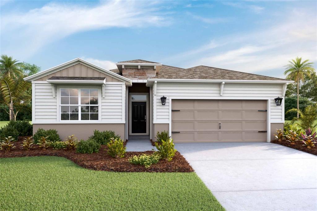 a front view of a house with a garden and garage