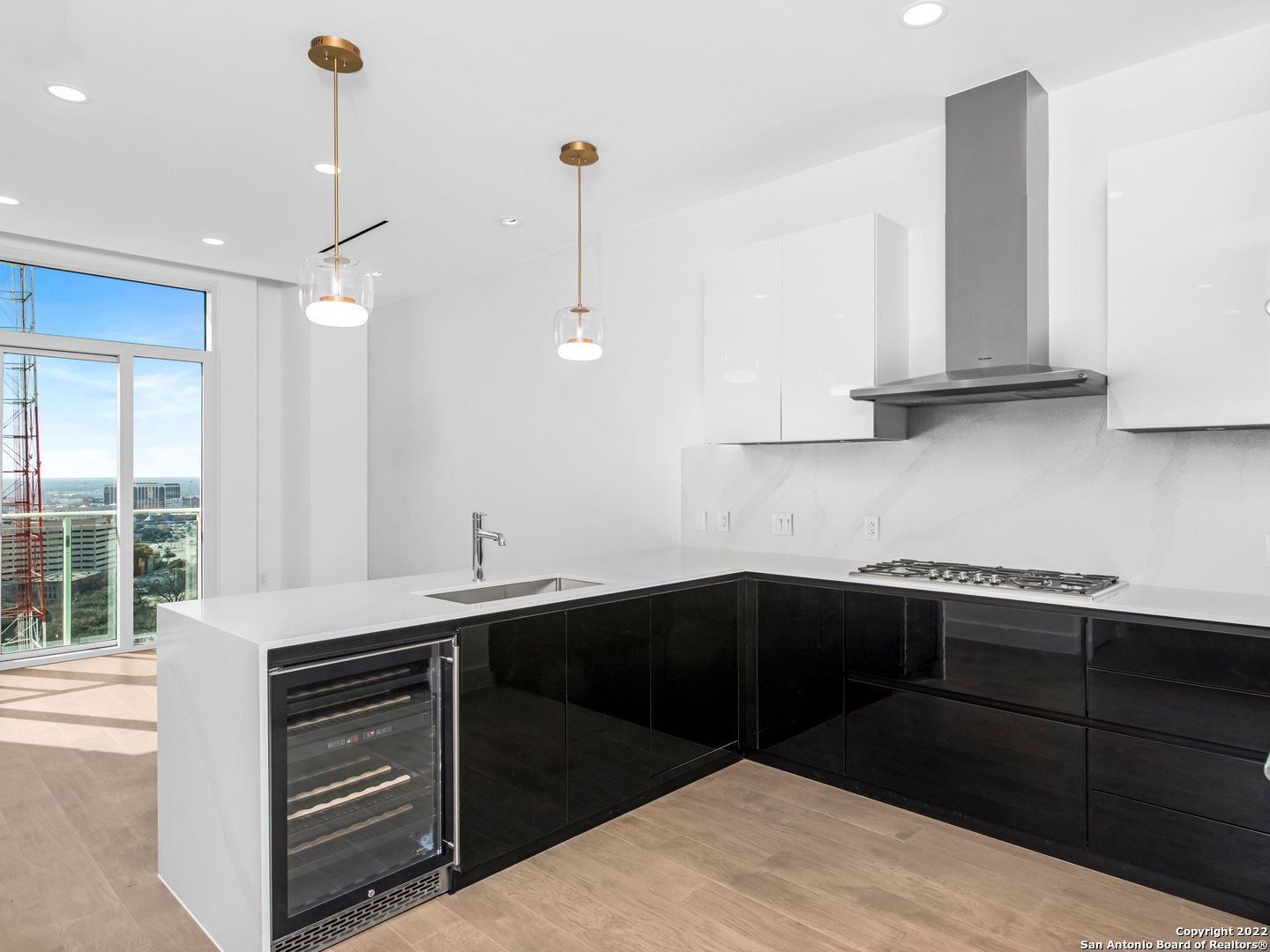 a kitchen with a sink and cabinets