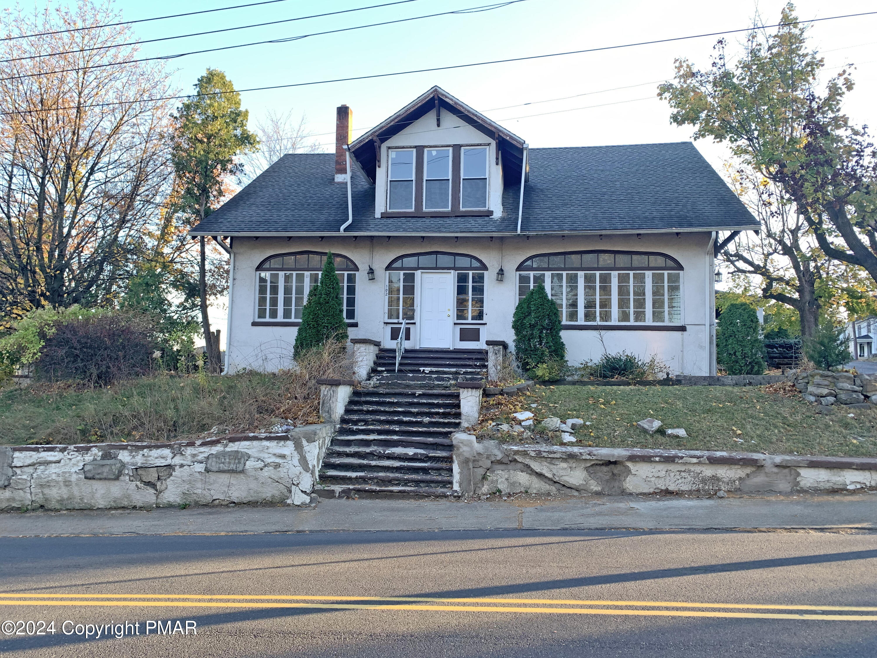 a front view of a house with a yard