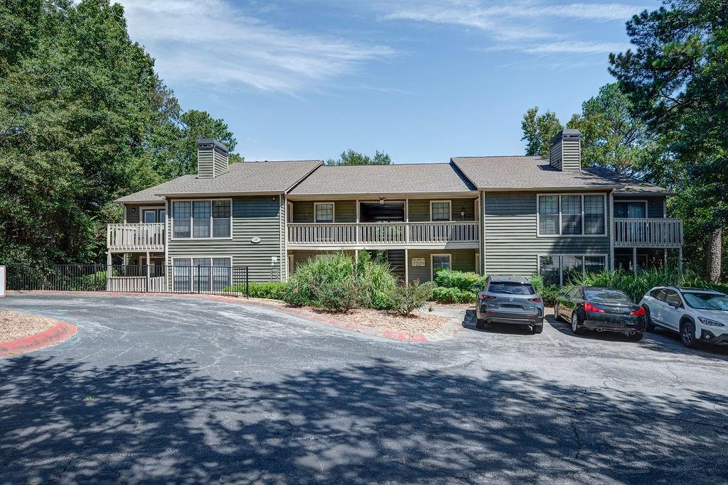 a front view of a house with parking area