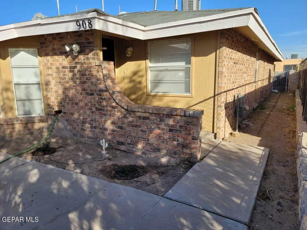 a front view of a house with parking