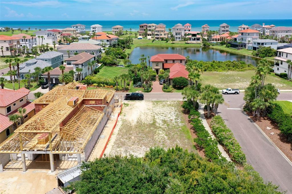 an aerial view of residential building and lake