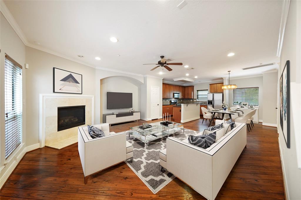 a living room with couches and a fireplace