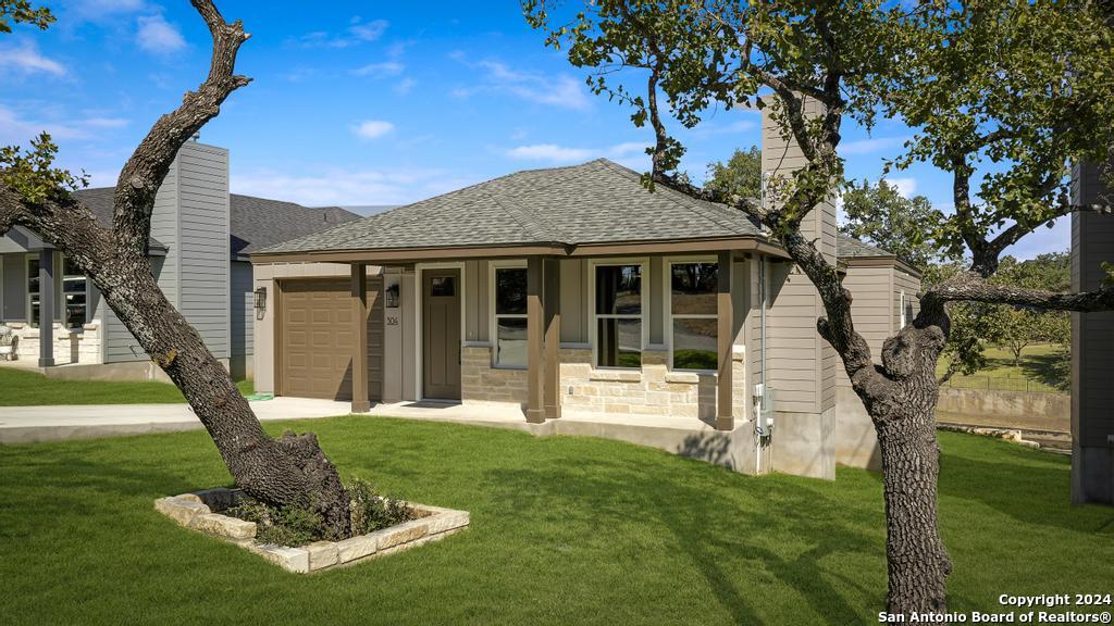 a front view of a house with a yard