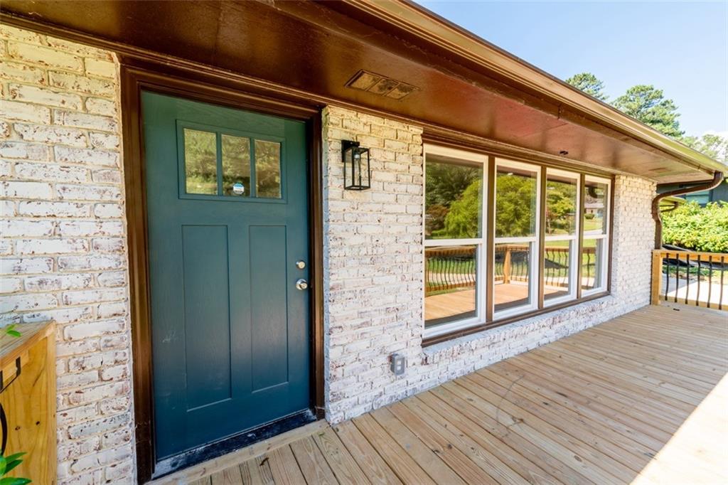 a view of front door of house with wooden floor