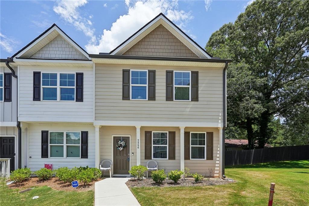 front view of a house with a yard