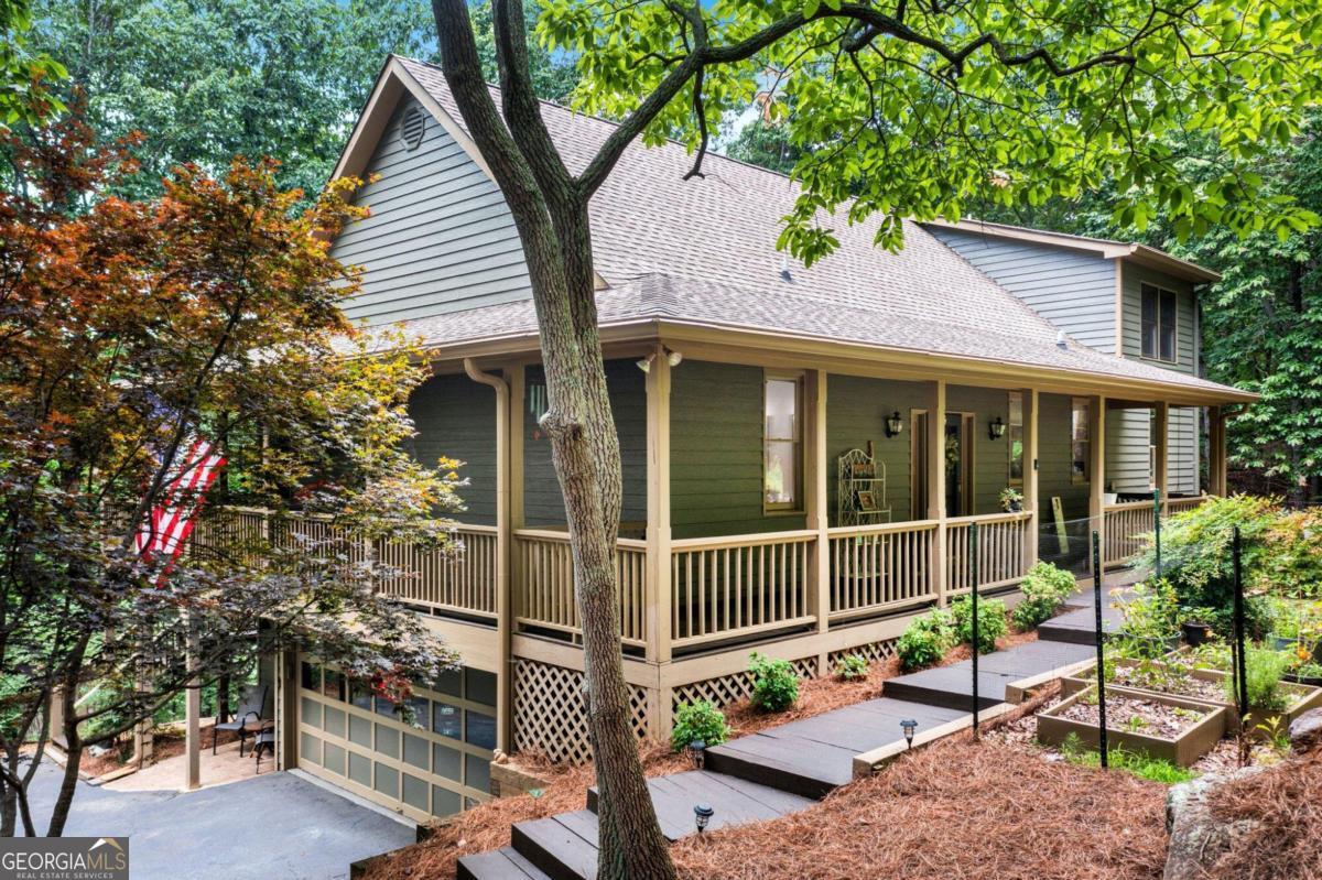 a backyard of a house with table and chairs