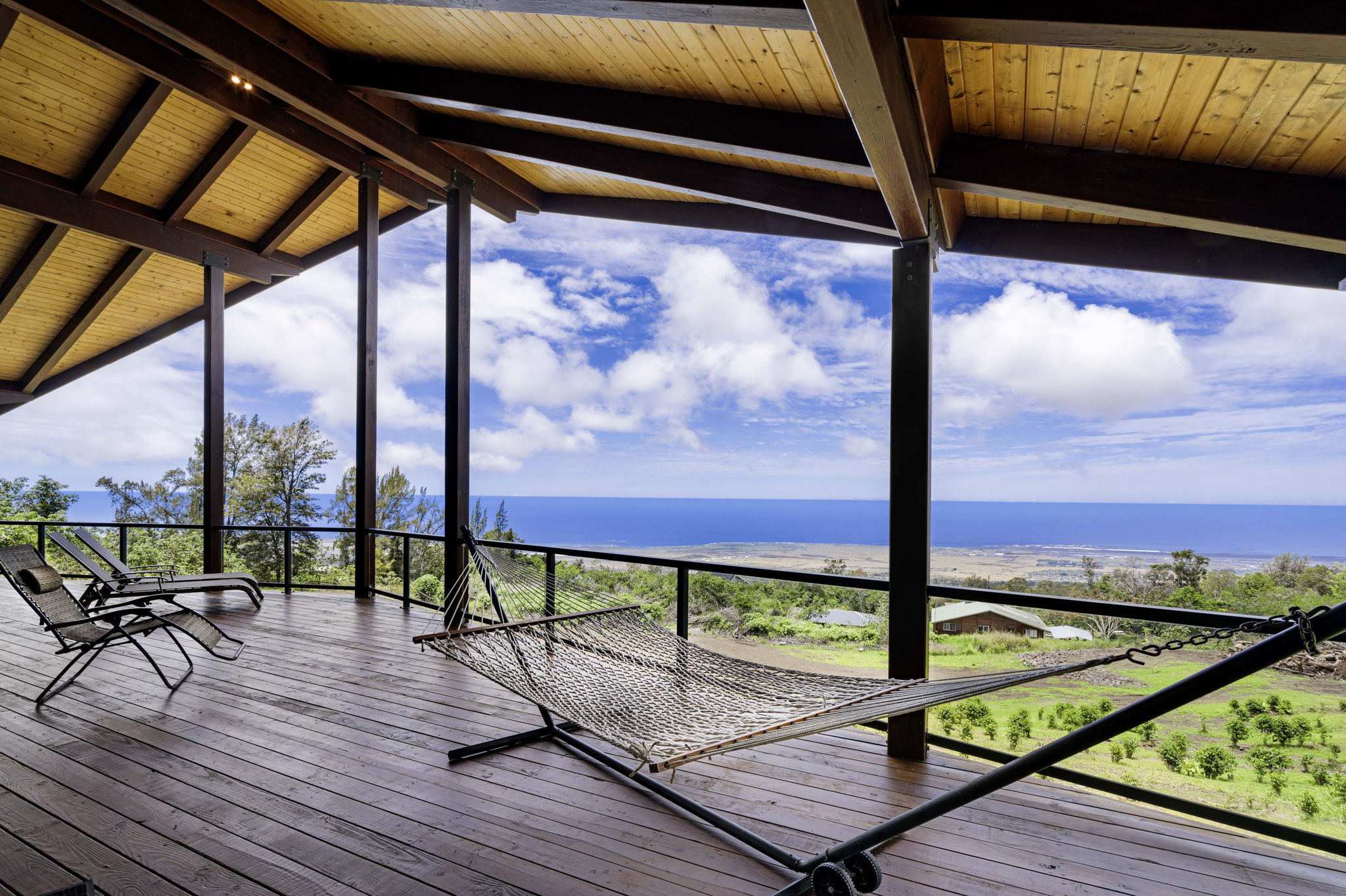 a view of a balcony with wooden floor