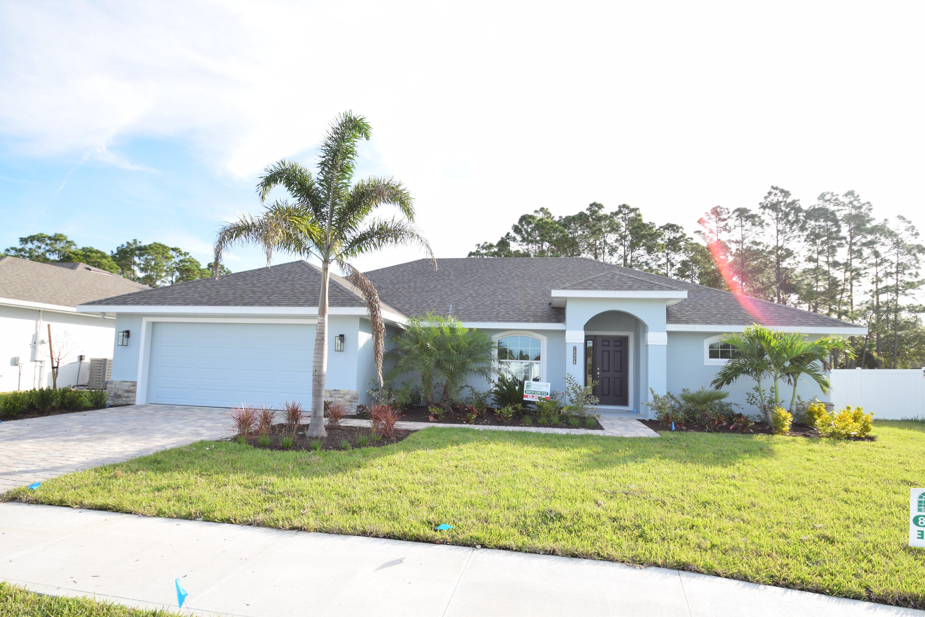 a front view of house with yard and outdoor seating