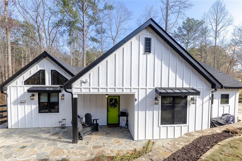 a front view of a house with a wooden fence