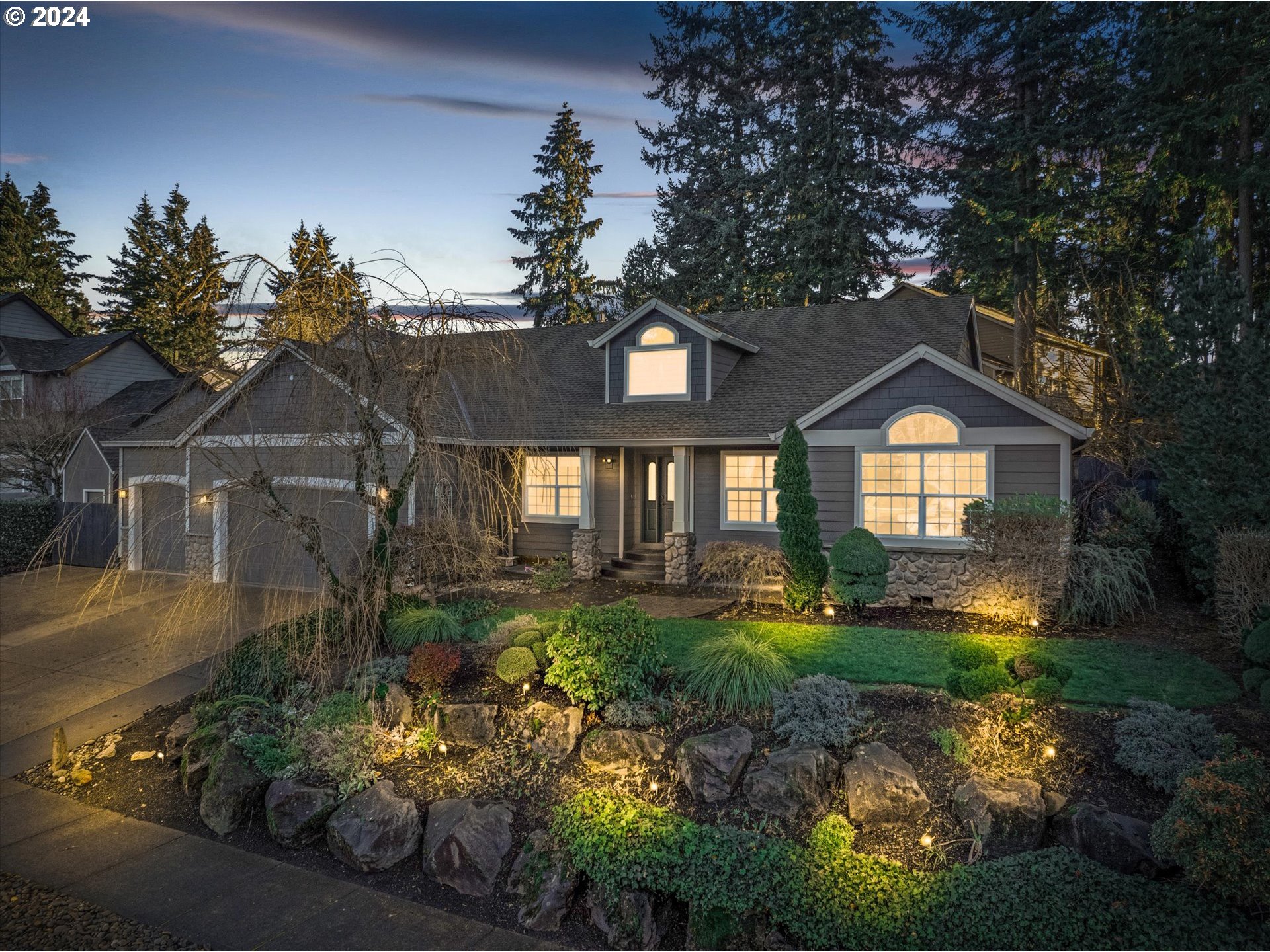 a front view of a house with a yard