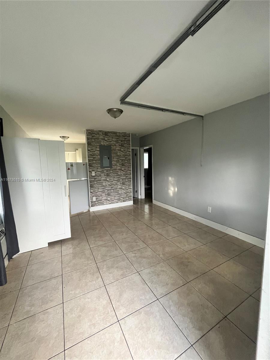 a view of livingroom with an empty space and window